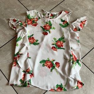 White top with floral designs